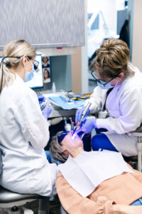 Dentists at Krengel Dental working on a patient during a teeth cleaning