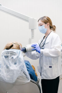 Krengel Dental Hygienist taking x-rays of patient. X-rays may be needed for detecting oral cancer