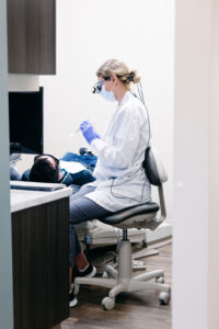 Is fluoride bad for you? A dentist at Krengel Dental using fluoride during a patient's teeth cleaning appointment