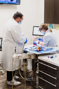A patient undergoing Invisalign treatment, braces for adults