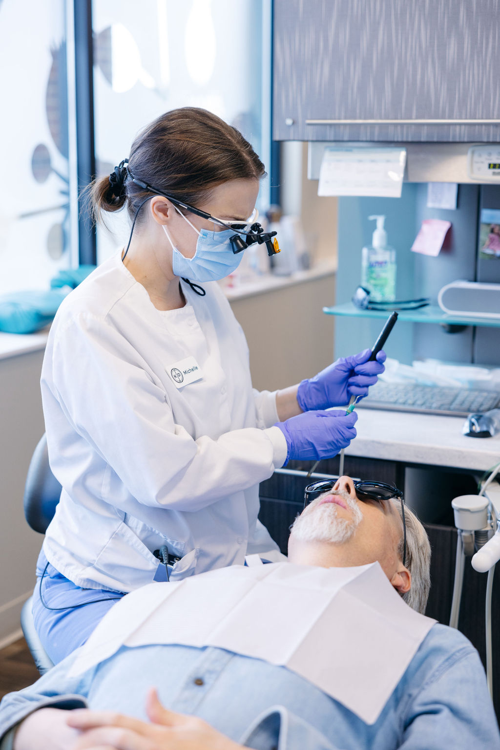A Krengel Dental dental assistant prepping for having a patient undergo root canal therapy.